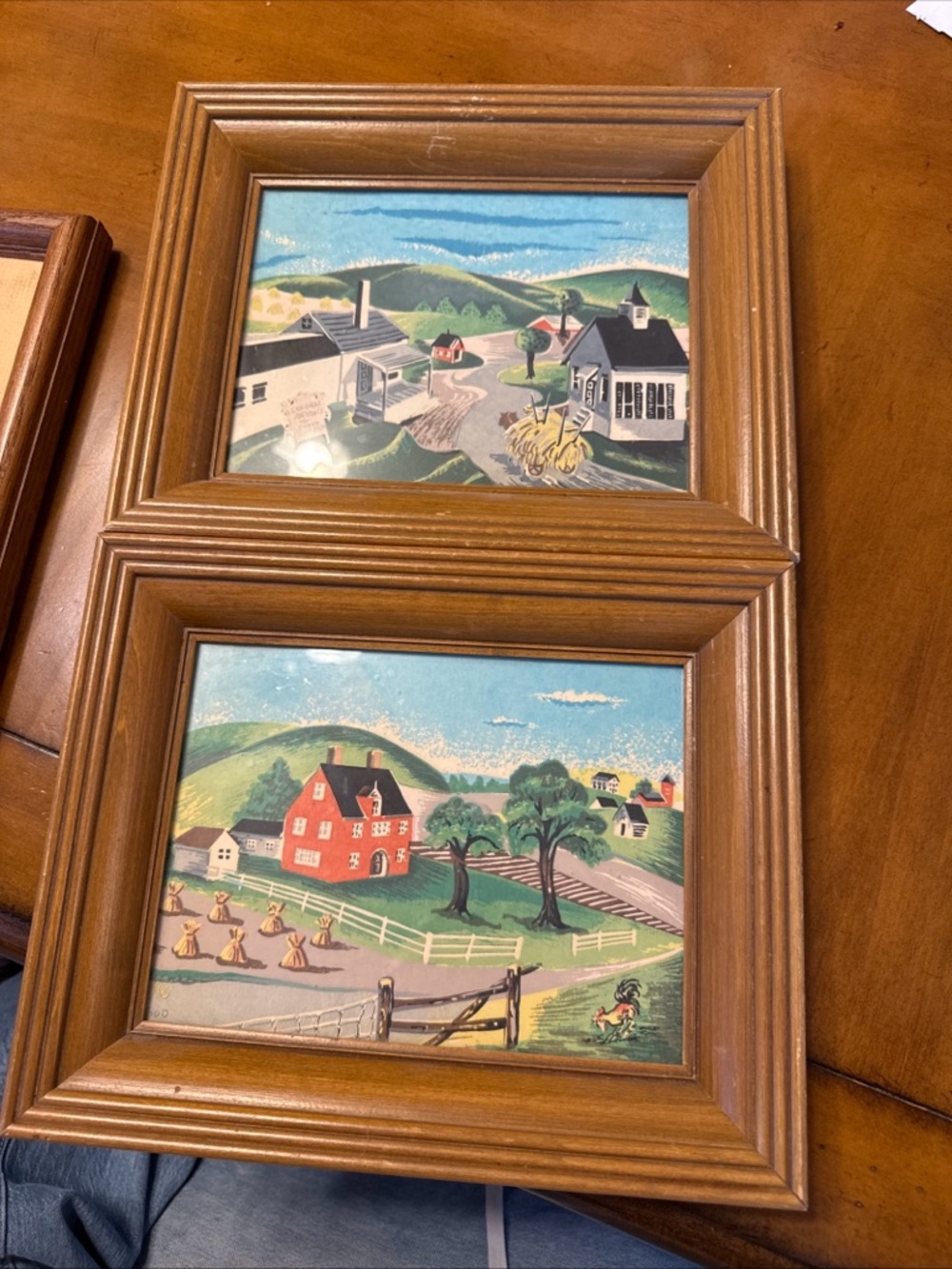 Framed artwork labeled "Treasure Town" and "Rolling Hills" by Todd